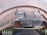 parking brake shoes drag because they drop out of position