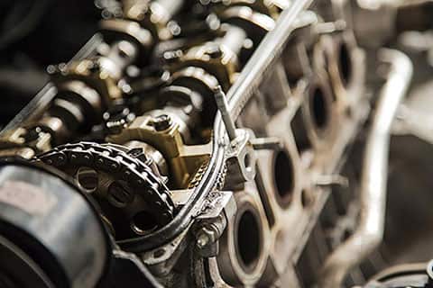 Overhead view of engine timing chain, valves, and pistons