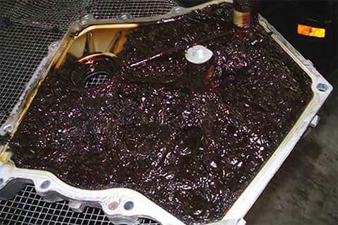 Oil pan covered in a thick sludge