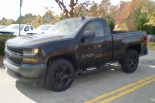 A blurry image of a Silverado that looks like it's bouncing up and down.