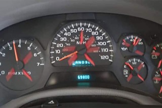A gauge cluster with superimposed arrows spinning in a circle.