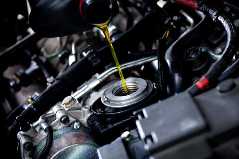 Oil being poured into an engine