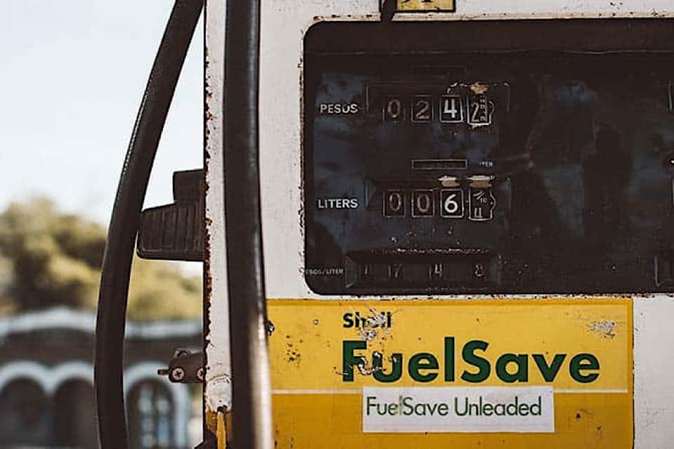 A yellow and white gas pump with the words Fuel Save on the front