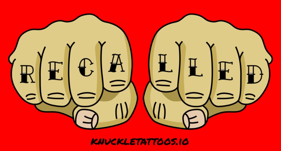 A hand with the word recalled tattooed on the knuckles