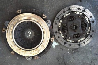 Disassembled clutch with a skull and cross bones