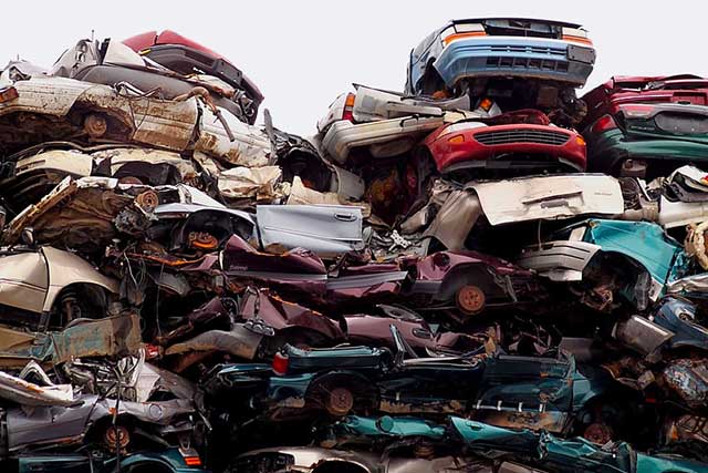A large pile of crushed cars
