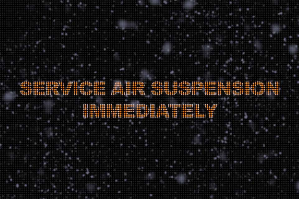 Console Message That Says Service Air Suspension Immediately, With Fake Ice on Top