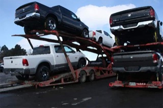 A group of Ram trucks on a tractor trailer