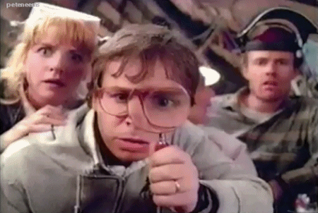 Video: Actor Rick Moranis Holds a Maginifying Glass in Front of His Eye