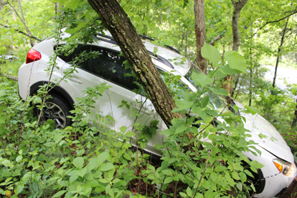 White Crosstrek crashed on an embankment