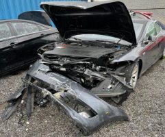 Tesla Sudden Acceleration Lawsuit Says Driver Fractured Spine