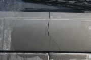 cracked panel below the rear window