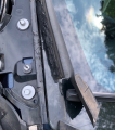 windshield trim blowing off