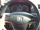 Honda logo on steering wheel reflects sunlight to eyes