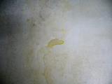 brown oily stains from A/C condensation when parked