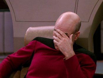 A disappointed Captain Picard with his face in his hand