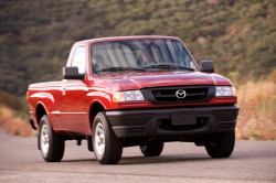 An old, red B-Series pickup truck