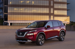 Front three-quarter view of a red Nissan Rogue