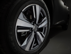 A close-up of a aluminum Nissan wheel