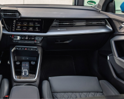 Inside view of the passenger side of an Audi vehicle with black leather seats