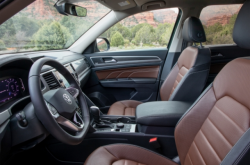 A Volkswagen interior with brown seats with black trim