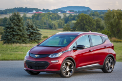 A red Chevy Bolt parked outside