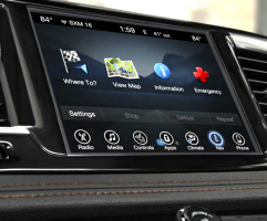 The Uconnect system home screen shown on a dashboard display