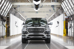 Ram truck in a shiny well-lit building"