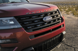 The grille of a red Ford Explorer