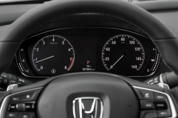 Looking over a Honda steering wheel at the console gauges