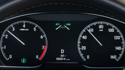 A Honda gauge cluster showing that certain safety features are activated