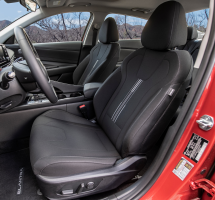 Looking through an open drivers-side door into a Hyundai Elantra