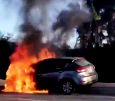 The front half of a Hyundai Santa Fe Sport engulfed in flames