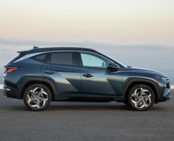 Side-view of a blue Tucson