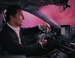 Actor Matthew McConaughey driving a Lincoln vehicle