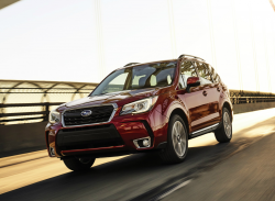 A red Subaru Forester on the highway